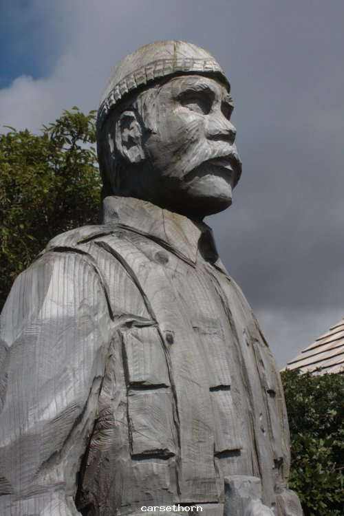 Carving @caresthorne in front of garden of rembrance