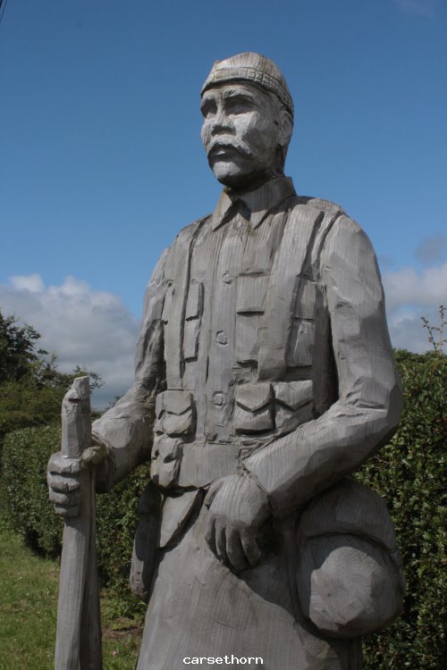 Carving @caresthorne in front of garden of rembrance